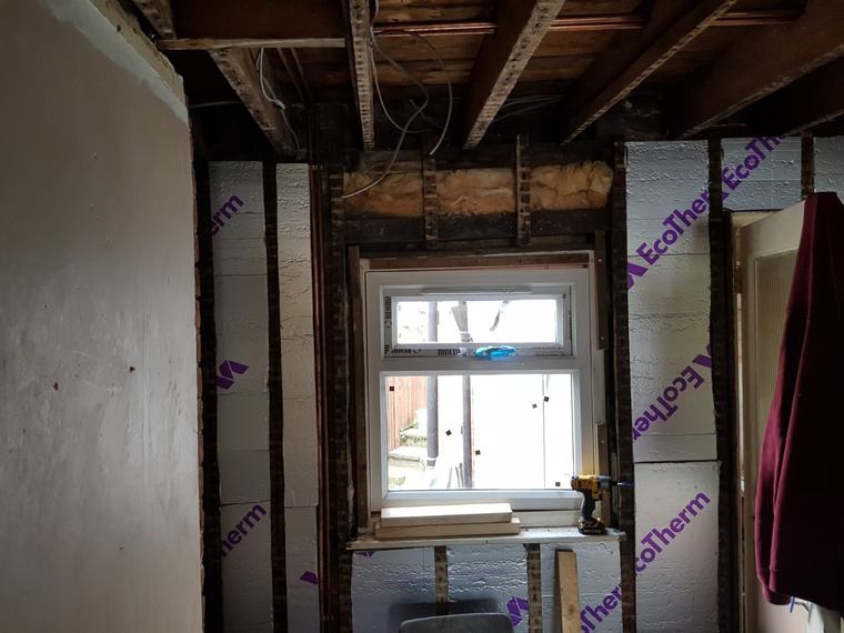 Window area with insulation and timber battens during refurbishment
